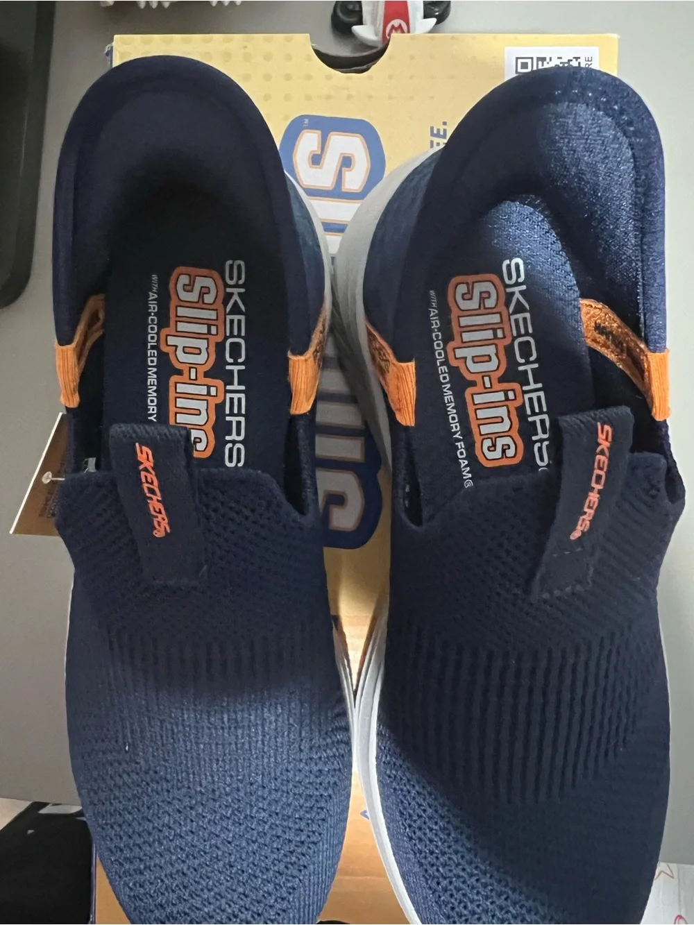 Skechers Kids Navy Slip-On Sneakers with Orange Pull Tab